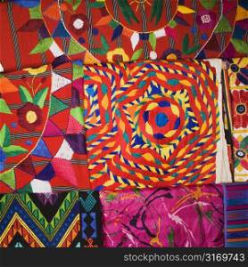 Close up of colorful tapestries.