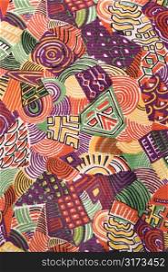 Close-up of colorful vintage fabric with abstract shapes printed on polyester.