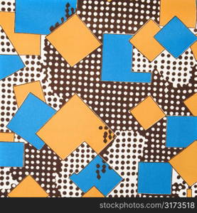 Close-up of colorful vintage fabric with blue and yellow shapes printed on polyester.