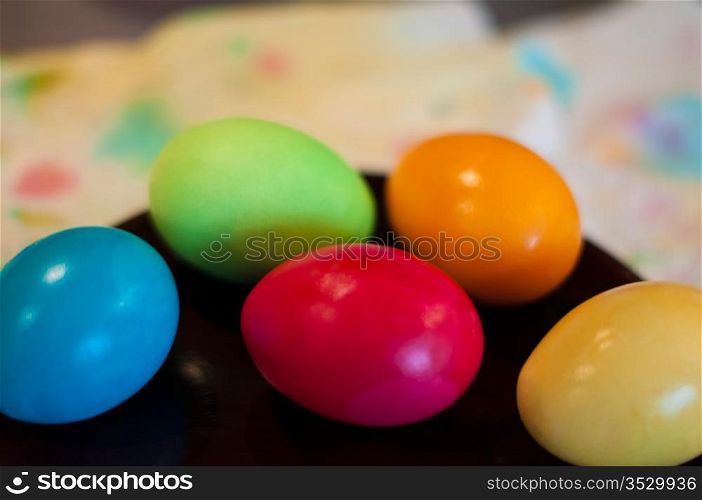 Close-up of coloured easter eggs on a plate