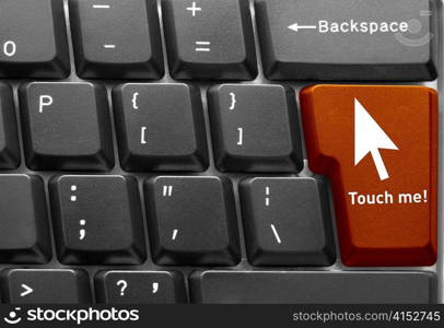 Close-up of Computer keyboard, with orange &acute;Touch me&acute; key
