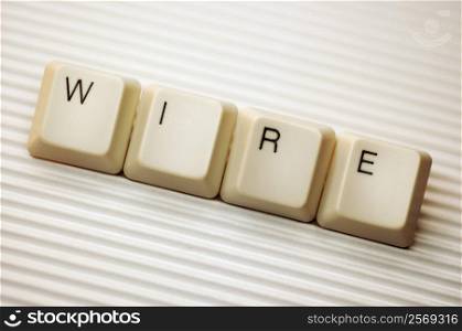 Close-up of computer keys spelling the word wire
