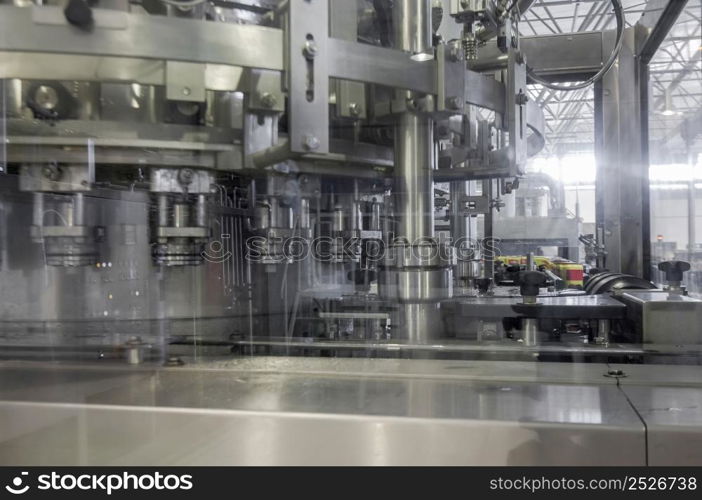 close-up of conveyor belt in motion at production and bottling of drinks in tin cans. production and bottling of drinks in tin cans. factory for bottling beverages in cans