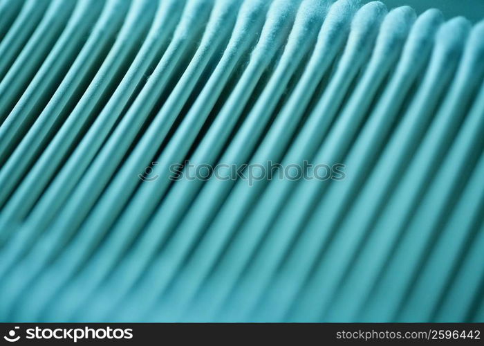 Close-up of cotton swabs in a row