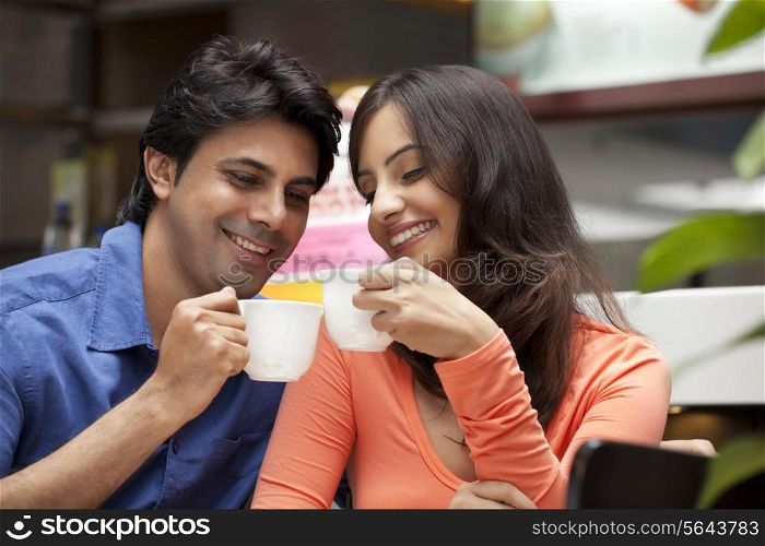 Close-up of couple enjoying their tea together in shopping mall