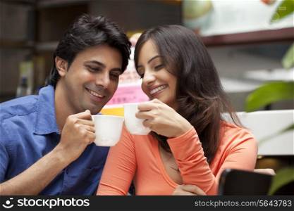 Close-up of couple enjoying their tea together in shopping mall