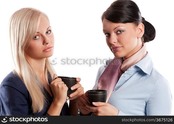 close up of couple young woman in formal dress drinking a cup of tea posing