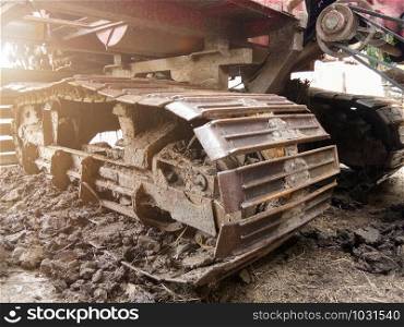 Close-up of Crawler tracks combine harvesters of The machine for harvesting from the fields.