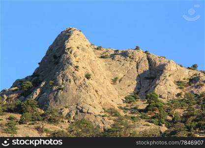 Close up of Crimean mountain peak against blue sky