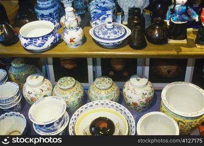 Close-up of crockery in a market stall, China