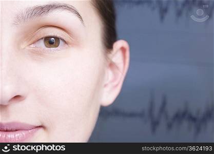 Close up of cropped woman face, sound wave graph in background
