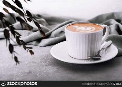 Close up of Cup of coffee with heart flower painted on foam