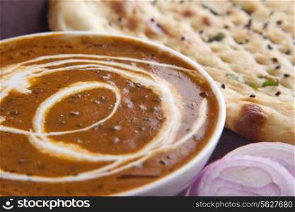 Close-up of dal makhni with naan