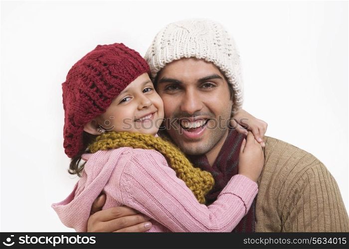 Close-up of daughter and father embracing