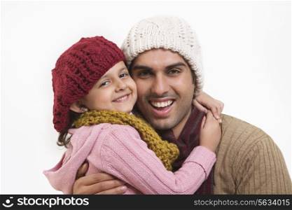 Close-up of daughter and father embracing
