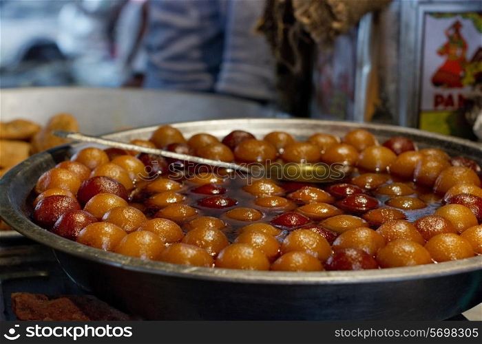 Close-up of delicious gulab jamun on display in stall