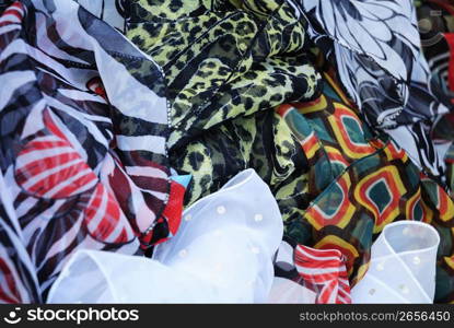 Close up of different coloured silk scarfs