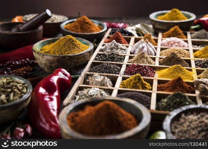 Close-up of different types of Assorted Spices in a wooden box. Spices in wooden box, Cooking ingredient