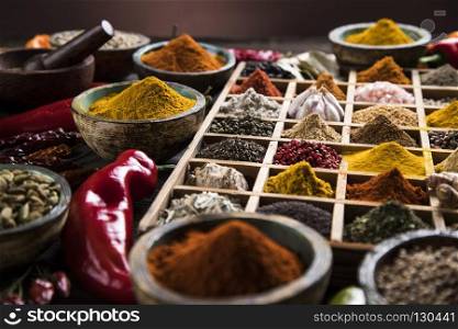 Close-up of different types of Assorted Spices in a wooden box. Spices in wooden box, Cooking ingredient