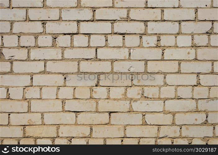 Close up of dirty white brick wall surface. Dirty white brick wall