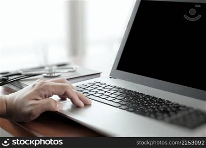 close up of Doctor hand using laptop computer in office