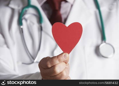 Close Up Of Doctor Holding Cardboard Heart