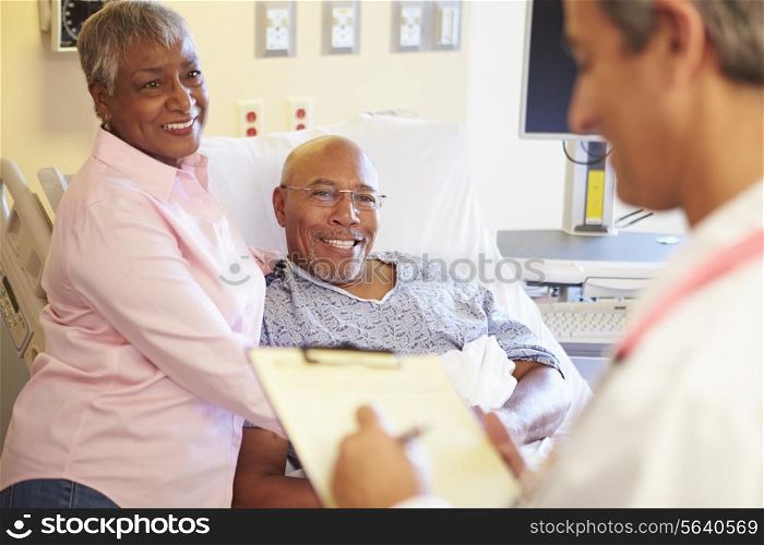 Close Up Of Doctor Updating Patient Notes