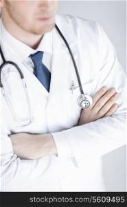 close up of doctor with stethoscope in white uniform
