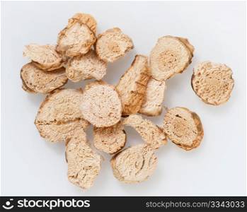Close-up Of Dried Galangal Slices, Up On A White Background