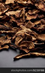 Close-up of dried porcini mushroom slices on moving platform 4K DCI. Close-up of dried porcini mushroom slices on moving platform