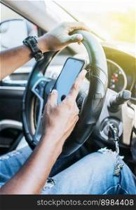 Close up of driver hands using his phone, Concept driver hands touching cell phone screen, Person in his car using cell phone