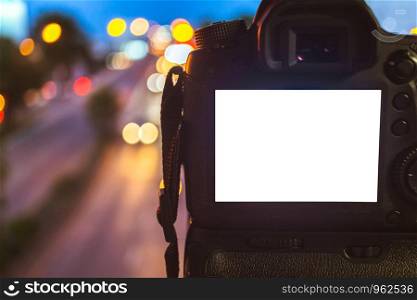 Close-up of DSLR Camera capturing on colorful light abstract circular bokeh background,Night time,Mockup image of with blank screen,DSLR on Tripod.