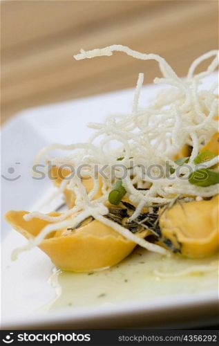Close-up of dumplings with noodles in a plate
