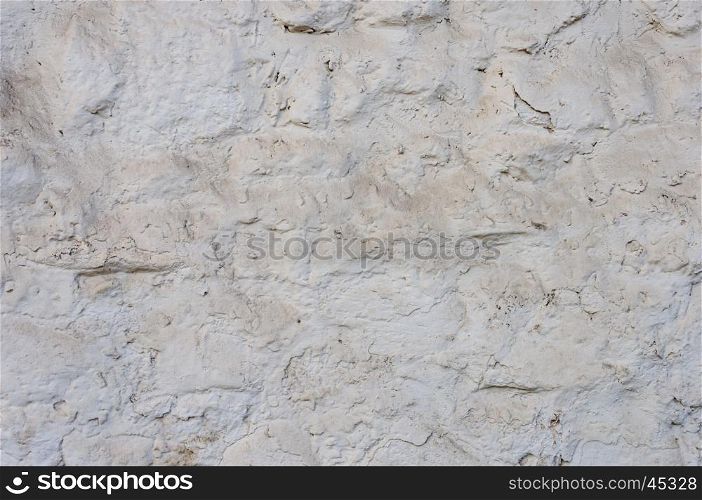 Close up of dusty rough white stone wall surface texture