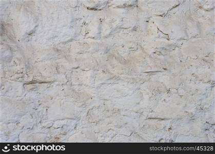 Close up of dusty rough white stone wall surface texture