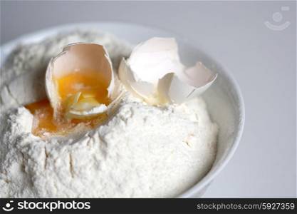 Close up of egg and flour