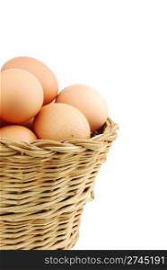 close-up of eggs in a traditional wicker basket isolated on white background