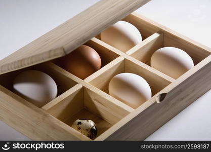 Close-up of eggs in a wooden box