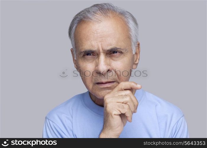 Close-up of elderly man thinking