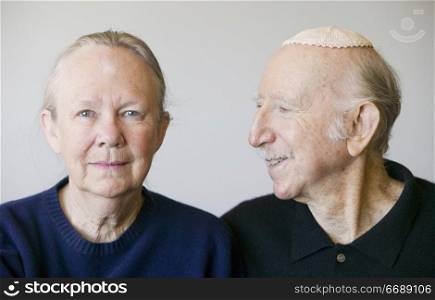 Close-up of eldery Jewish couple in studio.