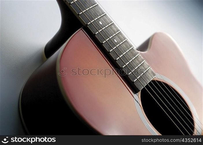 Close-up of electric guitar, its strings and frets