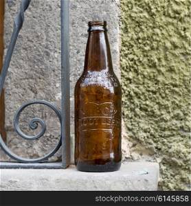 Close-up of empty beer bottle on window sill, Zona Centro, San Miguel de Allende, Guanajuato, Mexico
