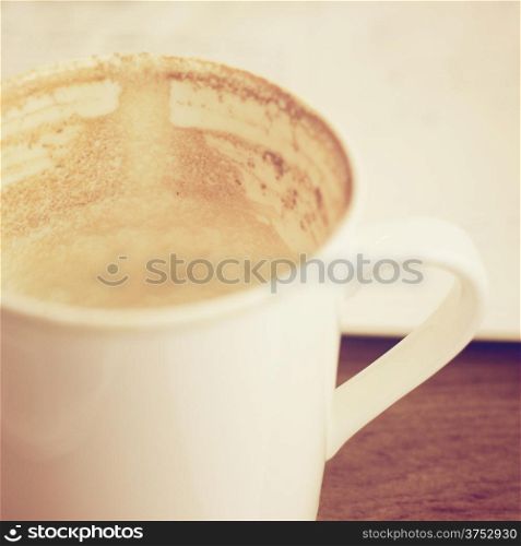 Close up of empty coffee cup with retro filter effect