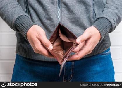 Close-up of empty purse in man&rsquo;s hands