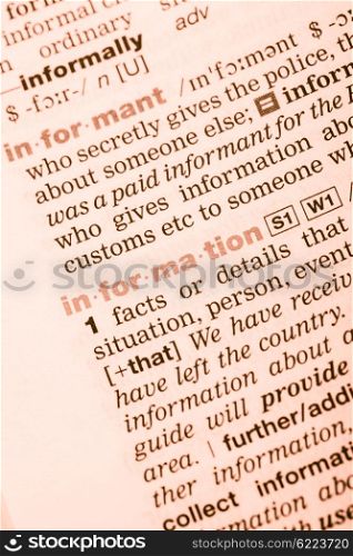 Close-up of English dictionary page with the interpretation of the word information. Vocabulary word information