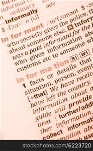 Close-up of English dictionary page with the interpretation of the word information. Vocabulary word information