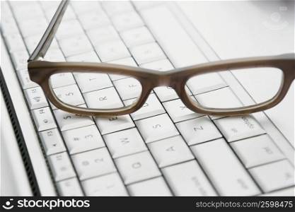 Close-up of eyeglasses on a laptop