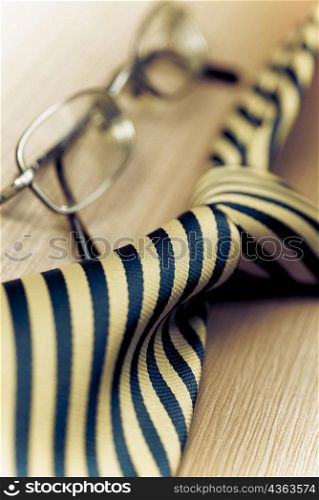 Close-up of eyeglasses with a tie