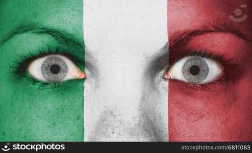 Close up of eyes. Painted face with flag of Italy