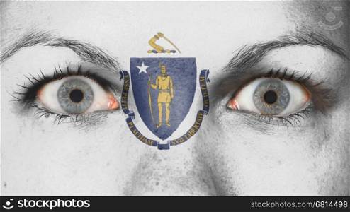 Close up of eyes. Painted face with flag of Massachusetts